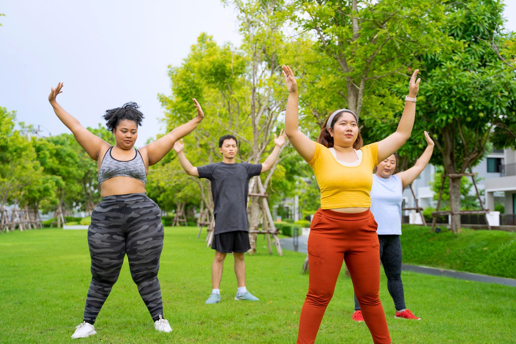Group exercising together in a public park