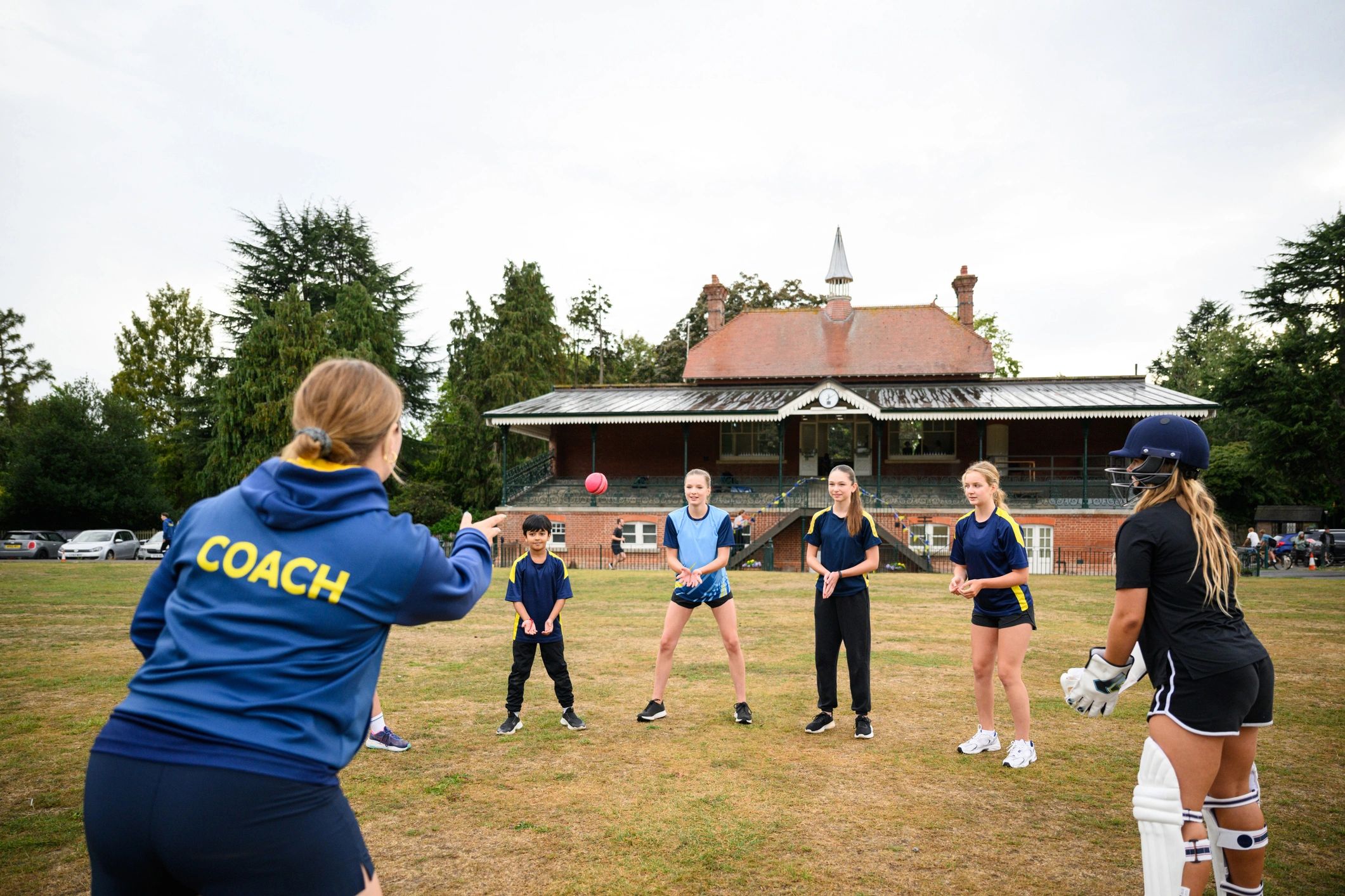 Youth athletes training with a coach
